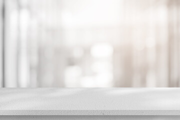 Abstract blurred interior modern office room background with perspective white cement table for...