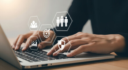 Strategic Business Planning Hands on Laptop with Digital Icons Representing Teamwork Goals Growth and Security in a Modern Corporate Environment