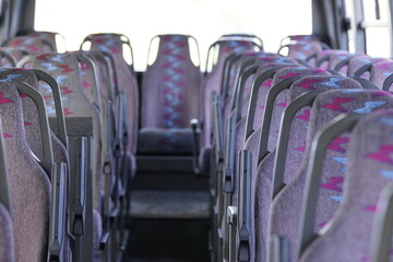 Empty bus interior with central aisle - clean, modern public transport. Modern empty bus interior...