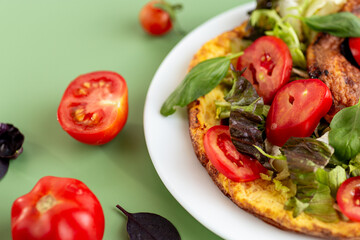 Fitness dish omelette with arugula, spinach and sweet pepper