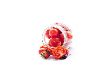 Marinated tomatoes in jars on a white background for winter storage