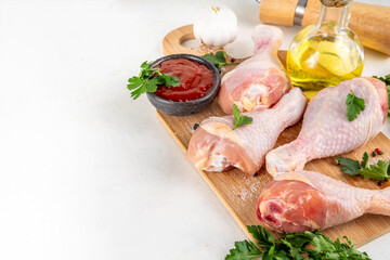 Food cooking background, raw chicken legs ready for grilling