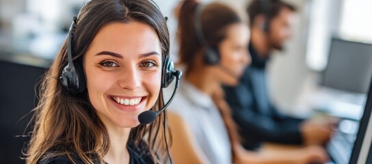 Smiling female customer service agent wearing a headset in modern office, ideal for business support, call center, helpdesk, and communication service promotions