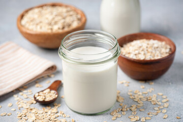 Glass of oat milk, vegetarian dairy free lactose free milk alternative