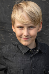 Portrait of a blond teenage boy on the street