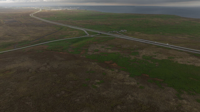 Aerial View of Icelandic Road Junction with Coastline in the Distance