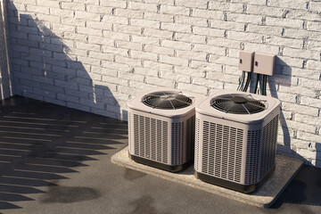 Two outdoor air conditioning units installed beside a brick wall, used for cooling systems in...