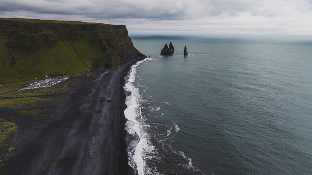 Reynisfjara Black Sand Beach with Basalt Sea Stacks in Iceland - Powered by Adobe