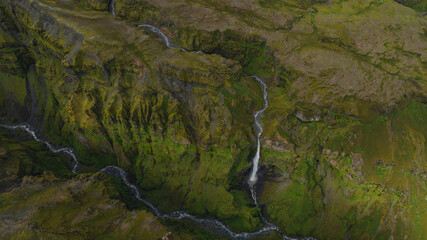 Aerial View of Moss Covered Canyon with Waterfall in Iceland