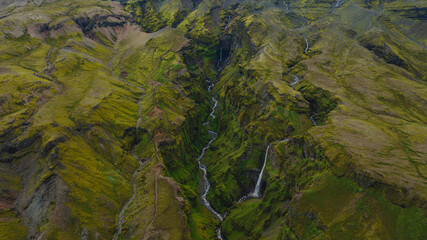 Aerial View of a Moss Covered Canyon with Waterfalls in Iceland