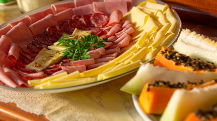 
Hearty breakfast served with cakes, pies, jams, pastries, cheese, ham, coffee, milk, cheese bread and much more