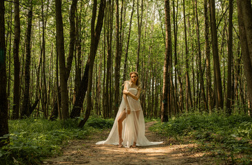 Portrait of a young beautiful girl in the image of a forest nymph