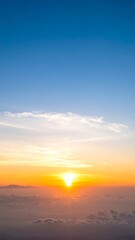 Fototapeta premium Sunrise over clouds