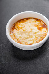 Rice pudding caramel syrup sweet dessert snack fresh delicious gourmet food background on the table rustic food top view copy space