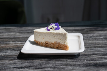 A piece of cheesecake on a white plate. 