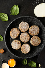 Flatlay of Frozen Cutlets on Frying Pan