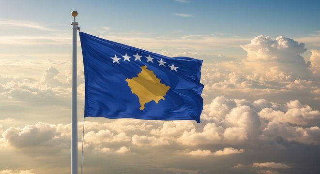 KosovoNational Flag Waving on Tall Flagpole in Sky with Clouds – Kosovo Independence Day Celebration, Patriotism, Freedom, Kosovo Culture & Heritage