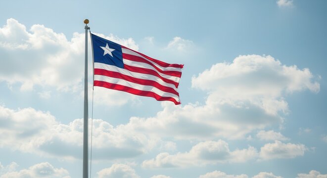 Liberia National Flag Waving on Tall Flagpole in Sky with Clouds – Liberia Independence Day Celebration, Patriotism, Freedom, Liberia Culture & Heritage
