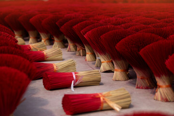 Traditional incense stick production in vietnamese village showcasing vibrant colors and...