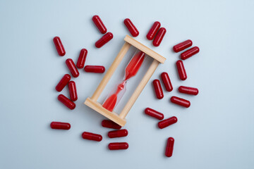 Time to take pills. Alarm clock shows time to take medicine. Taking vitamins or medicine. Concept...