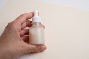 A jar of spa cream in the hands of a girl. Skin care. Medical and dermatological cosmetics for hands. Beauty and health of a woman. Spa treatments for the body. Container with natural cream close-up