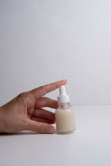 A jar of spa cream in the hands of a girl. Skin care. Medical and dermatological cosmetics for hands. Beauty and health of a woman. Spa treatments for the body. Container with natural cream close-up