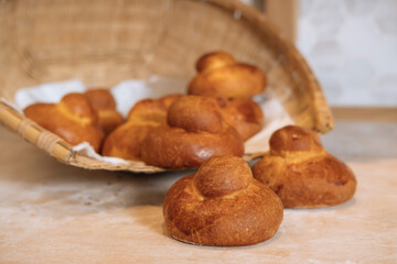 Sicilian Brioche Buns in basket Isolated on wooden Background closeup side view of italian baked