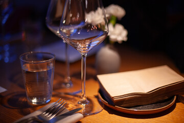 Elegant Table Setting with Glass and Napkins in Ambient Lighting
