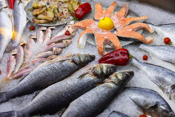 Fresh Fish and Seafood Display On Ice at a Market