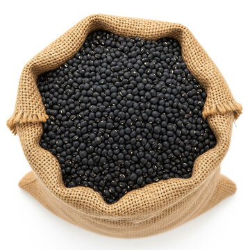 Top view of black urad dal in large burlap sack isolated on white