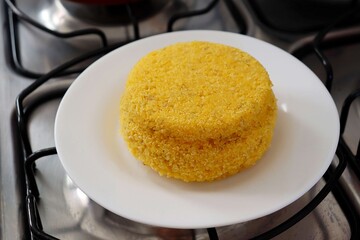 Brazilian couscous on the stove. Cuscuz brasileiro. Brazilian breakfast concept. 