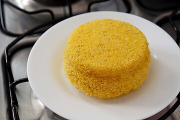 Brazilian couscous on the stove. Cuscuz brasileiro no fog&atilde;o. Brazilian breakfast concept. 