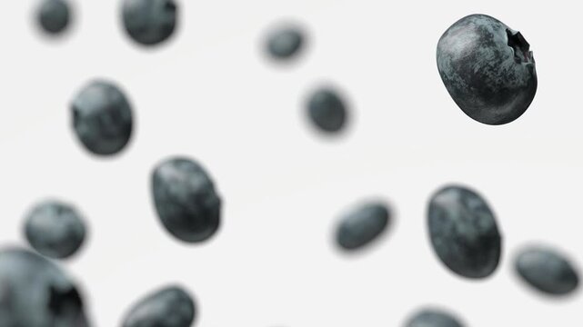 Blueberries falling in slow motion, depth of field