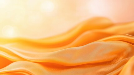 Obraz premium Soft orange fabric flowing gracefully under warm light