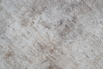 Abstract background. Rough stone or plaster surface in grey and brown tones. Ideal background for...