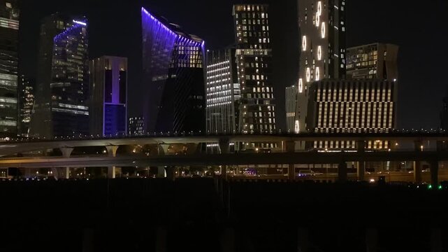 Modern skyscrapers of KAFD in Riyadh at night, Saudi Arabia financial district, cinematic skyline.