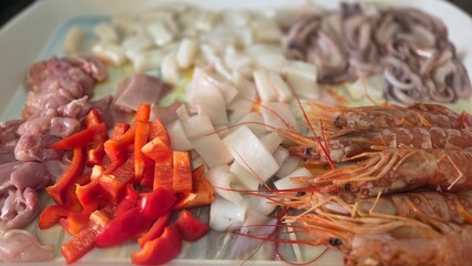 Fresh ingredients for authentic spanish paella dish preparation. Typical cuisine of Spain. Valencian cuisine. Stage of cooking paella. Ingredients for paella