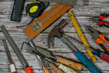 Carpentry tools on a wooden workbench, ready to be used for home renovation or construction