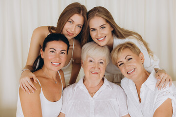 Fototapeta premium Family of women smiling and posing together