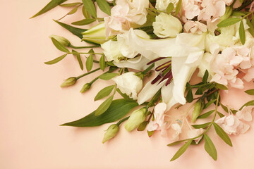Summer blossoming delicate lilias and ranunculus on blooming flowers festive background, pastel and...