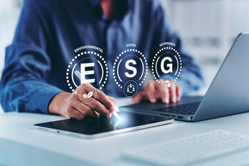 ESG icon of saving clean energy environment social governance concept, Man hand pointing to analyze on screen in business investment strategy, green eco friendly, environment, go green, CO2, ESG