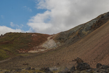 Rugged Icelandic Hillside with Volcanic Terrain and Small Figure