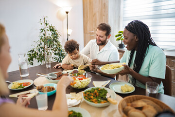 A joyful family meal together in a cozy dining room