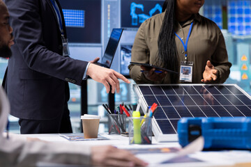 Research and development factory department team evaluates innovative solar cell designs, using...