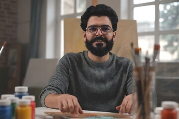 Artist painting tutorial online class bearded man with glasses art studio creative workshop canvas paintbrushes