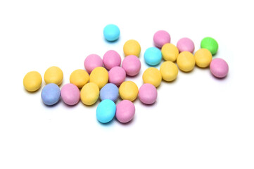 Closeup of colorful chocolate candies on white 