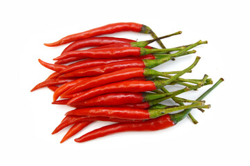 Stack red chili peppers and basil herb leaves  on the white