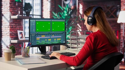 Woman filmmaker works on post production with mockup at home office, ensuring the editing timeline and color correction for video shoot. Tech driven workspace showcases workflow. Camera B.