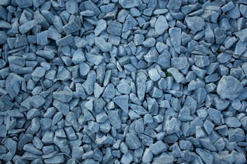 Top view of large gravel stones on a natural path, textured surface