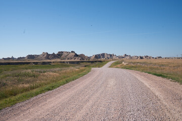 Curved gravel road through prairie in Badlands National Park, South Dakota